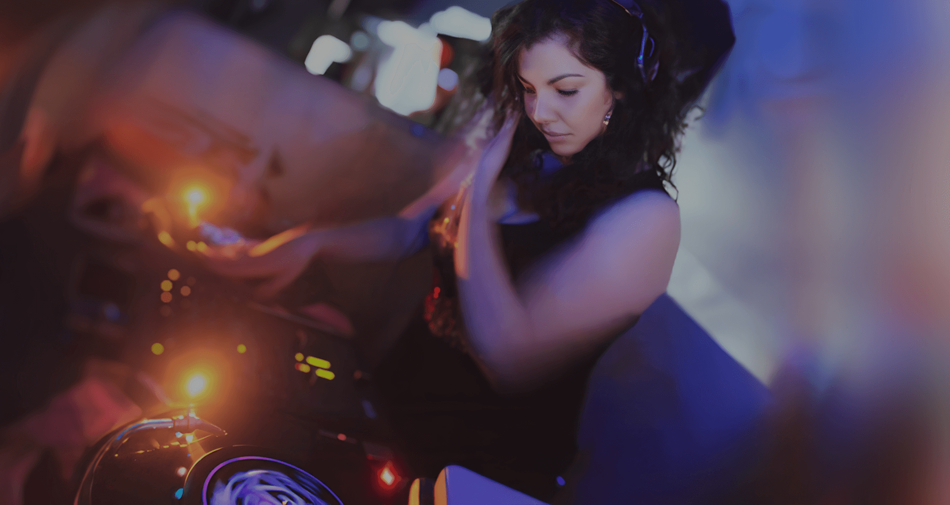 DJ Miss Deezy mixing at a nightclub in NY